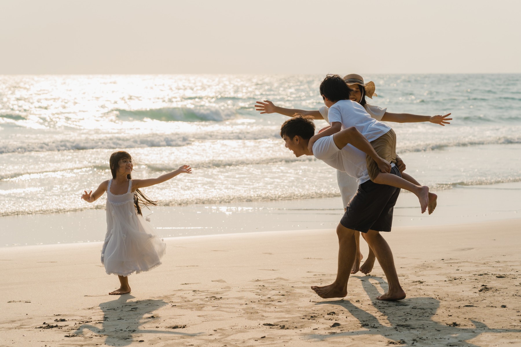 Happy Family Enjoy A Beach Holiday