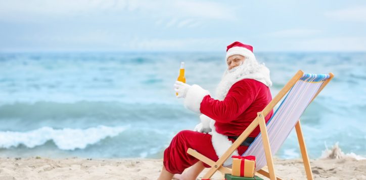 authentic-santa-claus-with-bottle-drink-relaxing-deck-chair-beach-2
